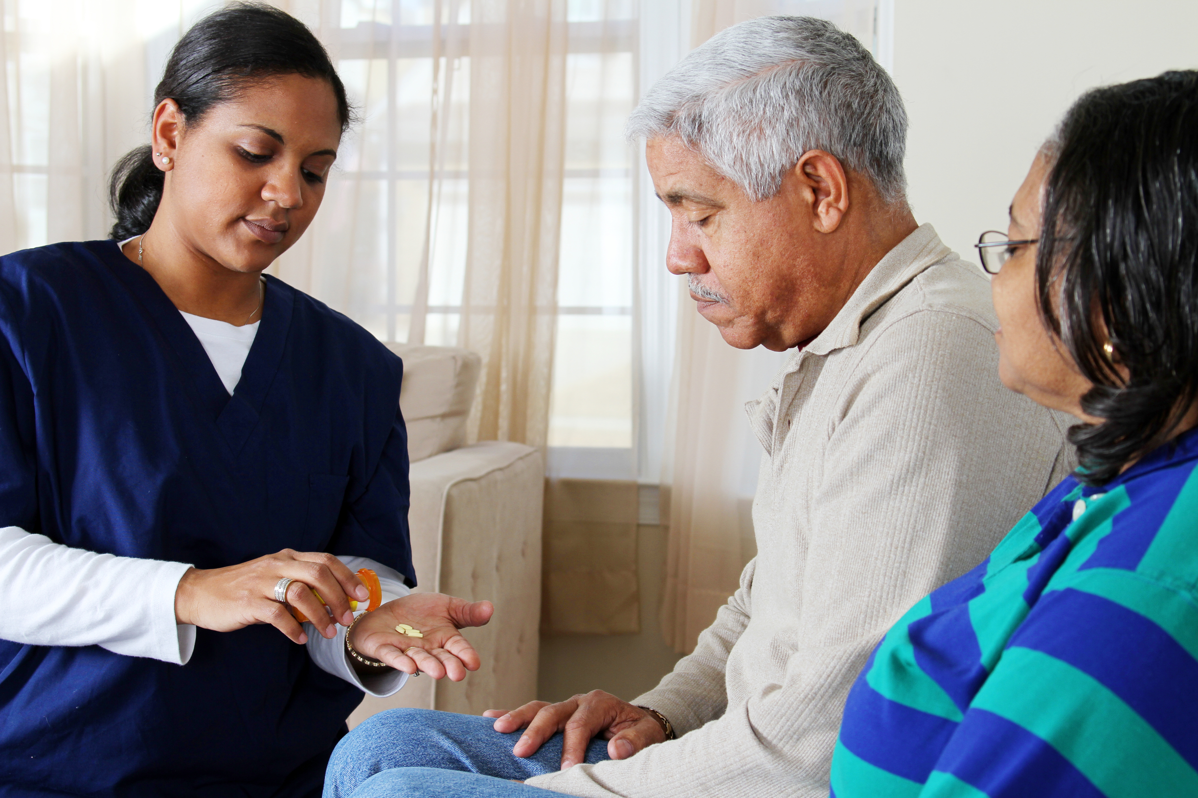 Home health care worker and an elderly couple